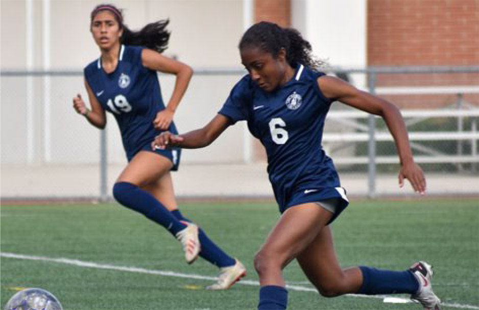 Students playing soccer