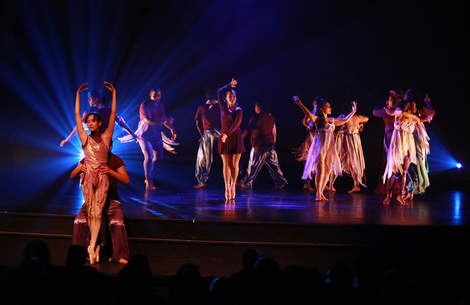 Dancers on dark stage