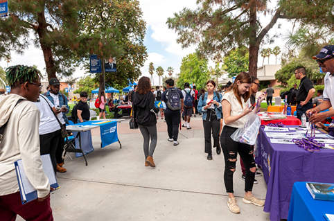 Students walking around a university transfer fair