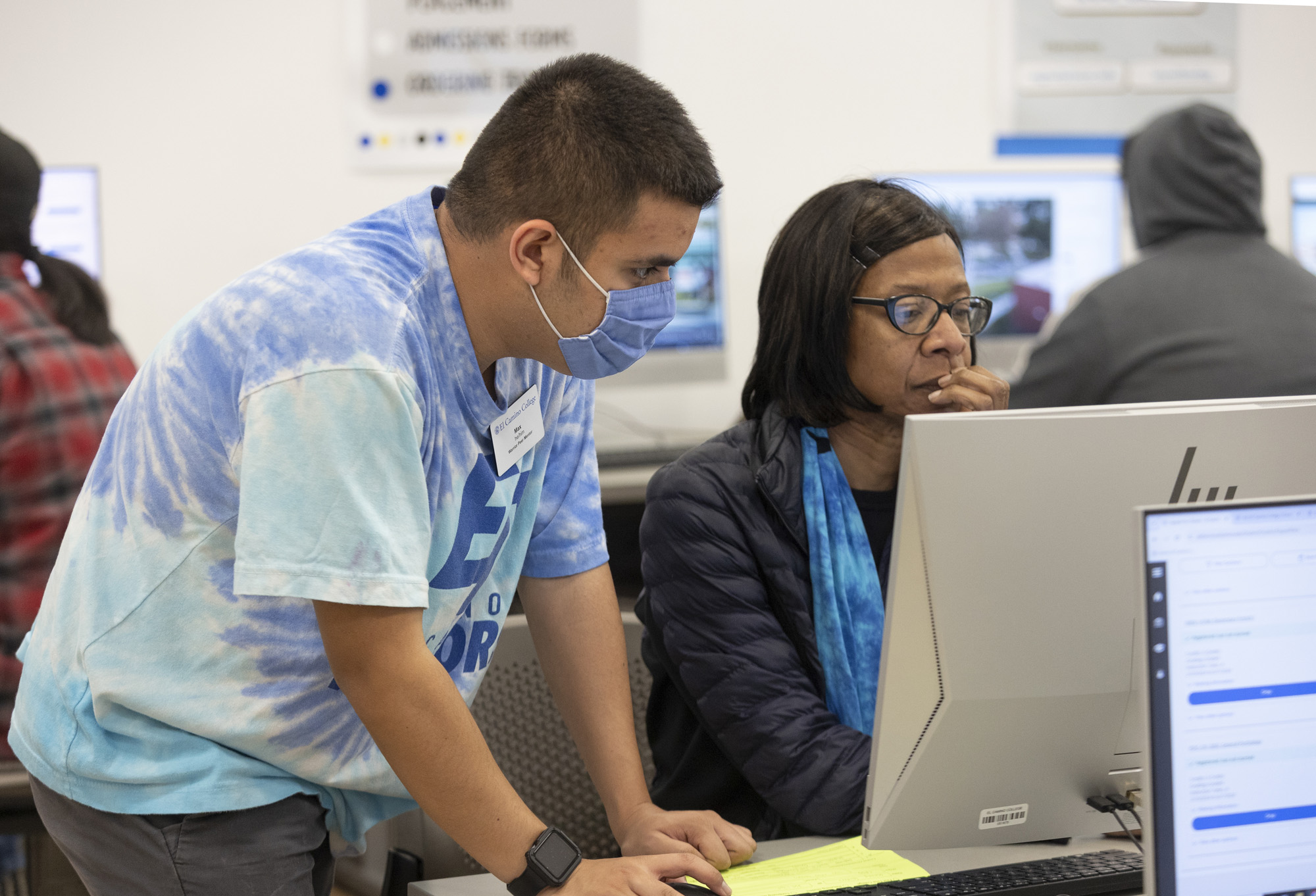 Counselor and student working on a computer