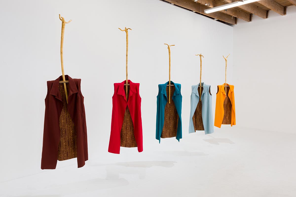 Five Sheaths Five garments, each 48” x 14” x 4”, suspended on wood rods  Cotton, wood  2017