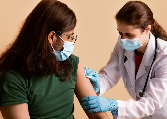 Nurse administering shot to patient