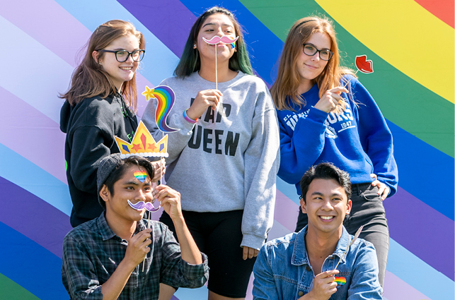 Students celebrating at an LGBTQIA+ event on campus.