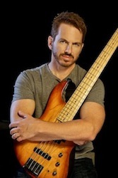 headshot for Larry Steen hold bass guitar