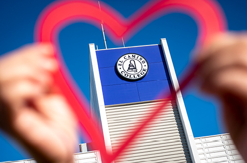 View of the ITEC Building through a paper heart cut-out 