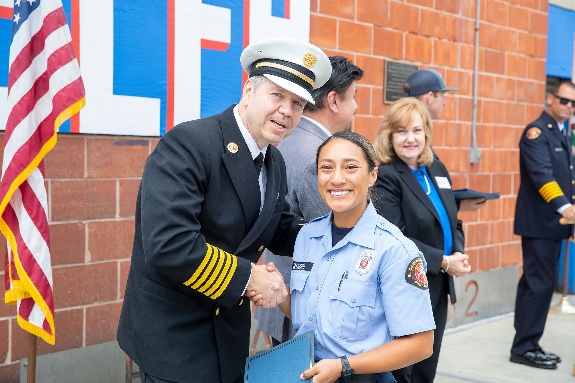 Instructor awarding a student a certificate