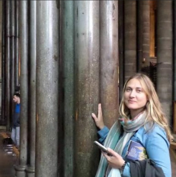 Karen Whitney in front of column