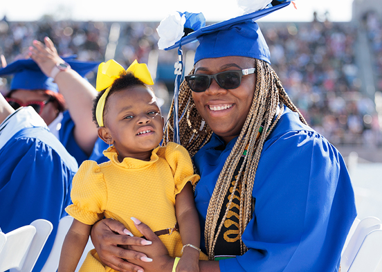 LaTanya King smiling with her daughter at commencement.